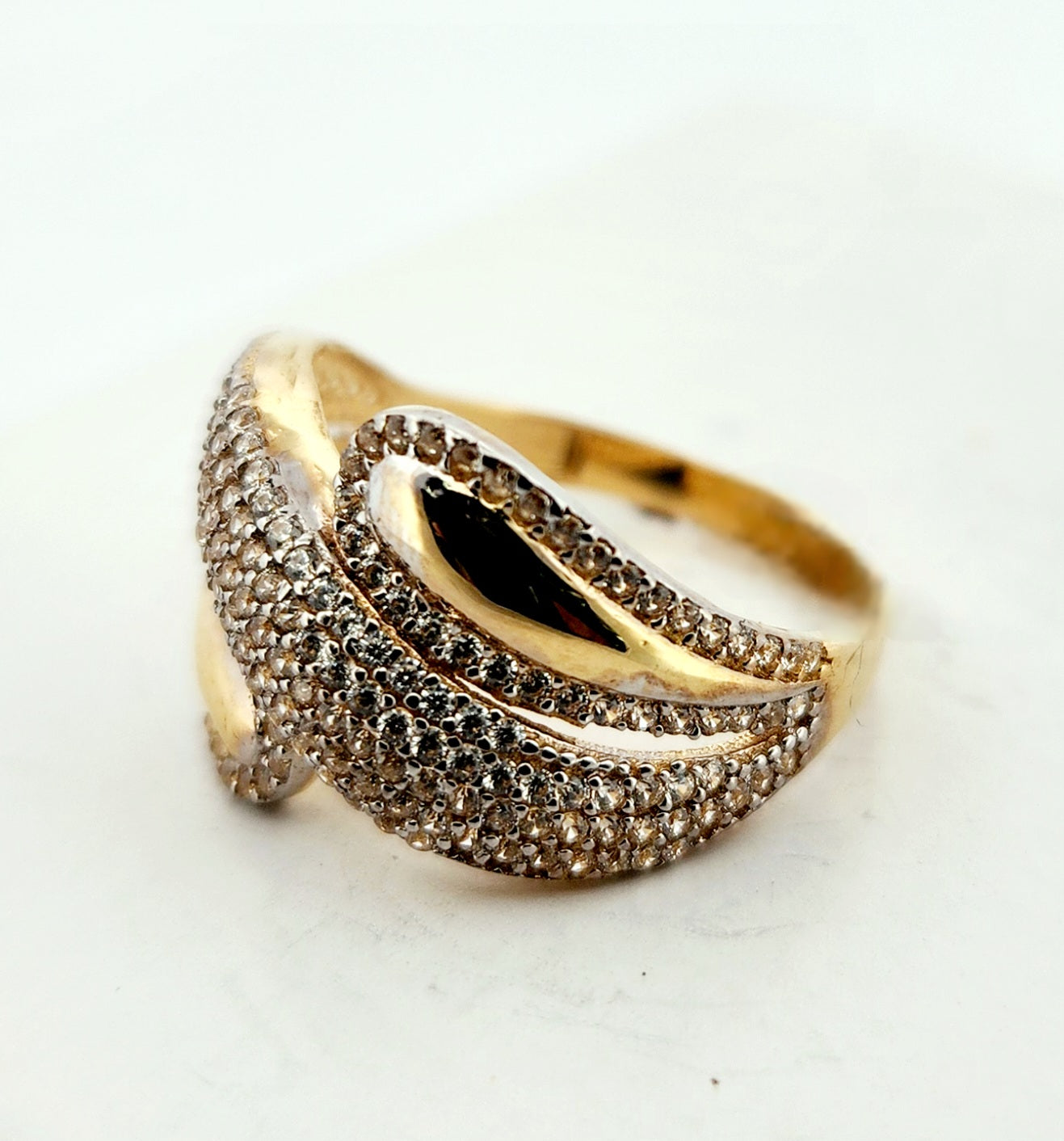 WOMAN'S 18k stones wave line with lateral drops/zircon stones